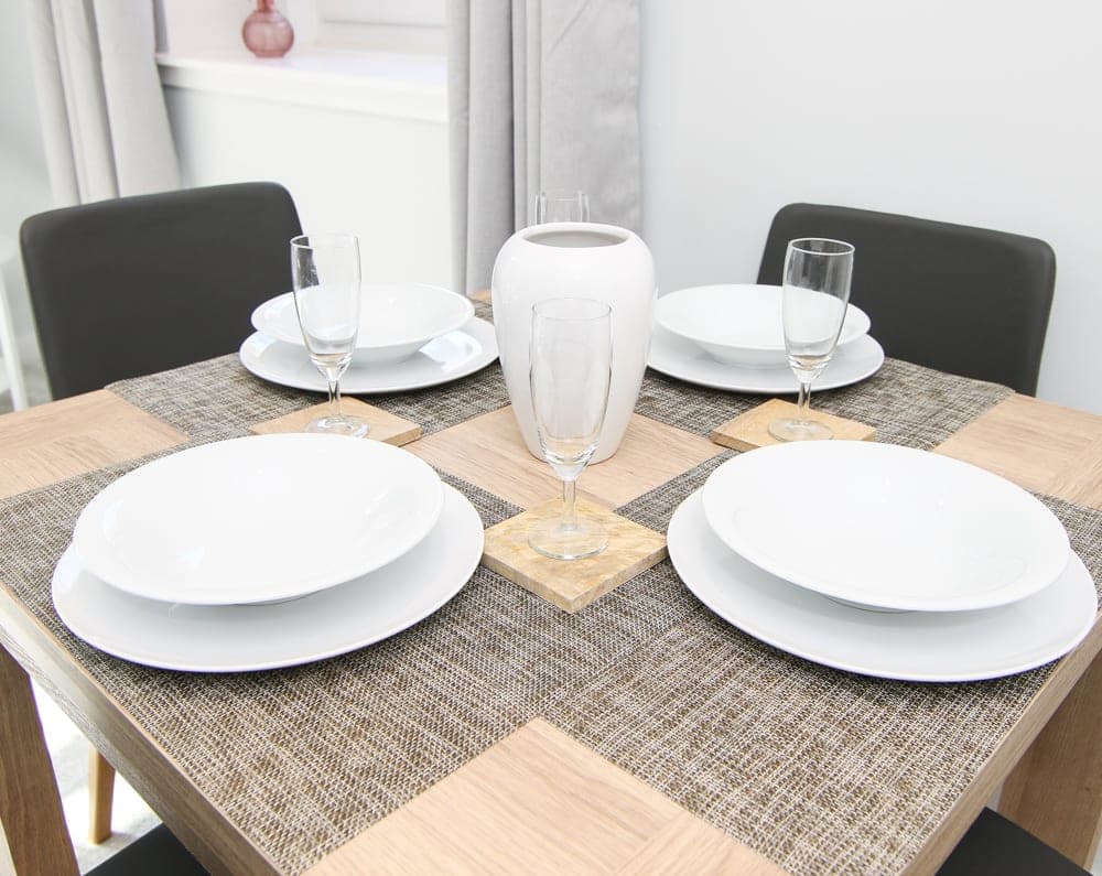Dining table set for four