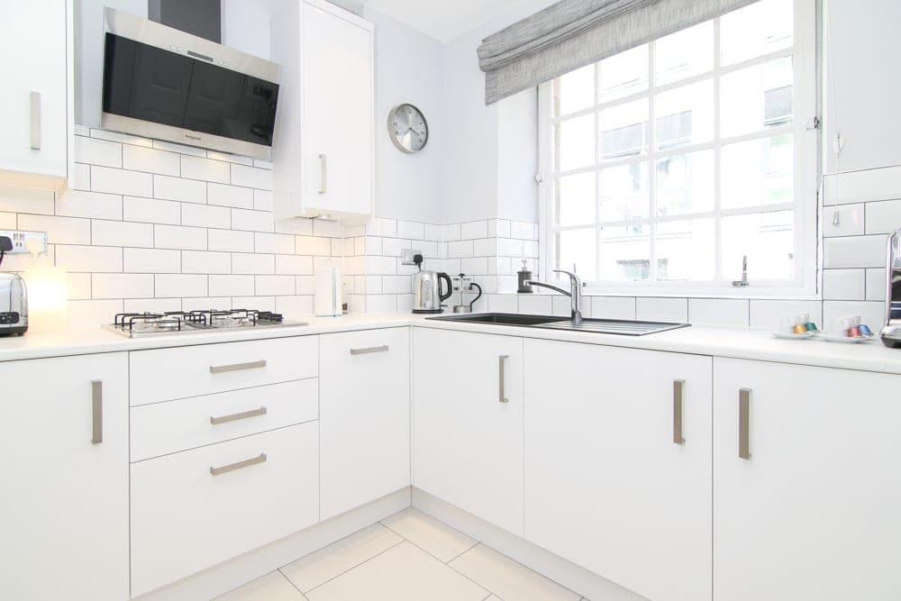 Kitchen with oven, gas hob and Nespresso machine